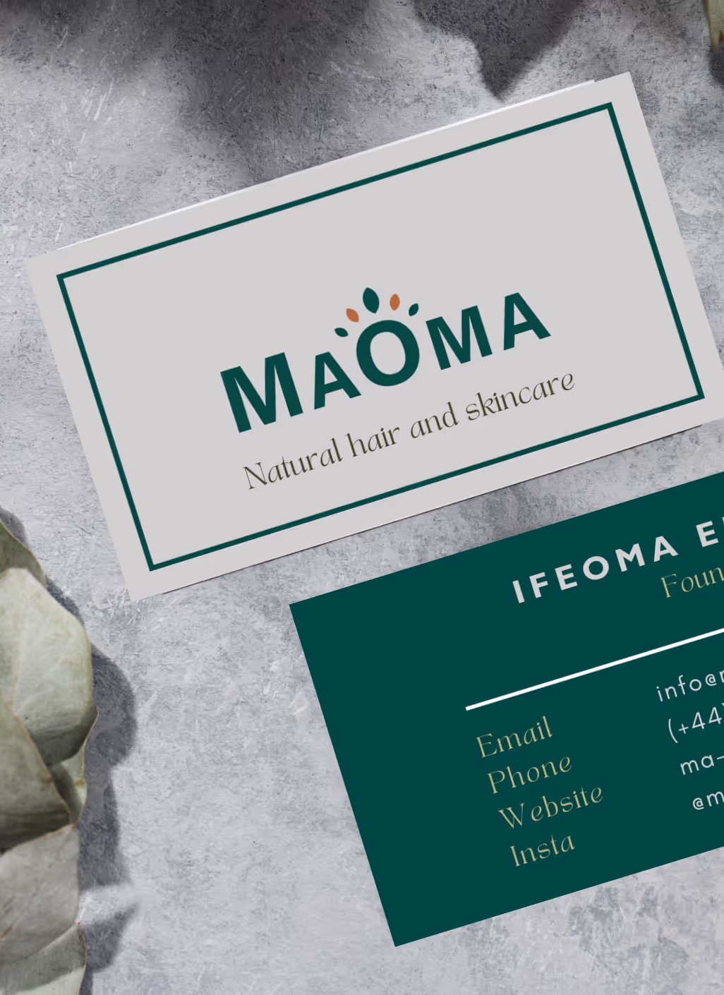 Business cards for MaOma, a natural hair and skincare brand, featuring a green and beige color scheme.