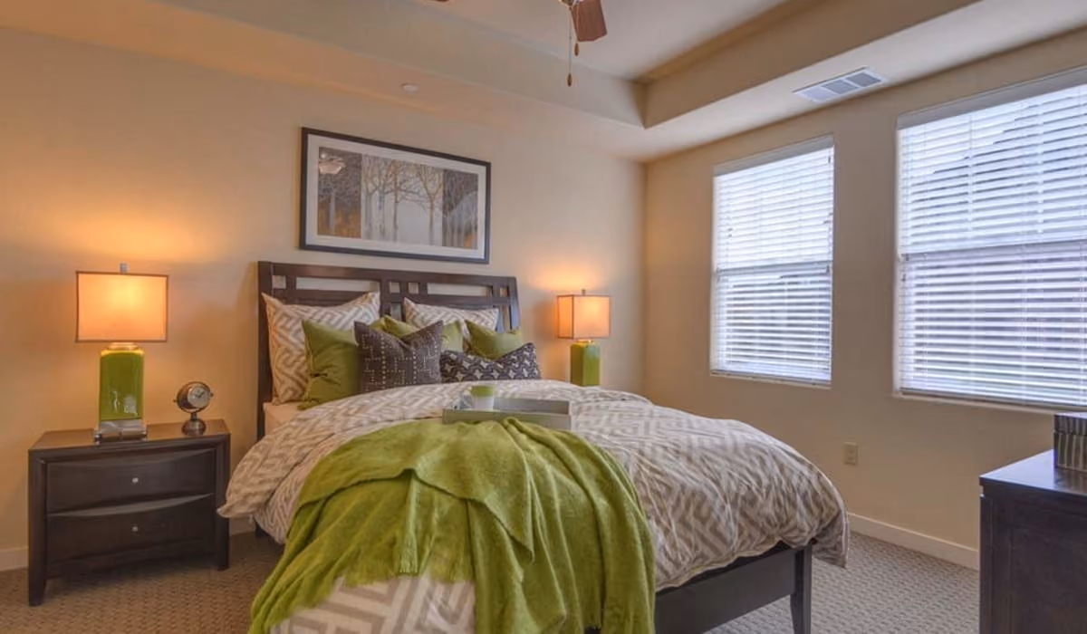 Bedroom styled with bed and furniture