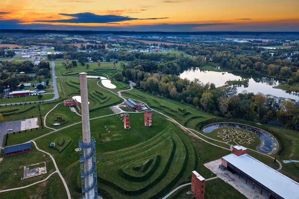 Rastin Observation Tower rising above the lake and walking trails at Ariel-Foundation Park