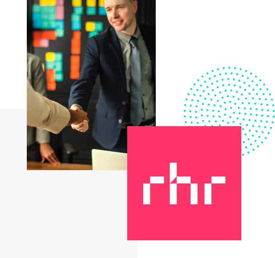 Two businesspeople shaking hands in office with colorful sticky notes on the wall behind them.