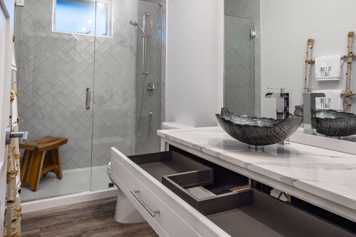 A clean bathroom in the Comox Valley with an open drawer that is clean inside.