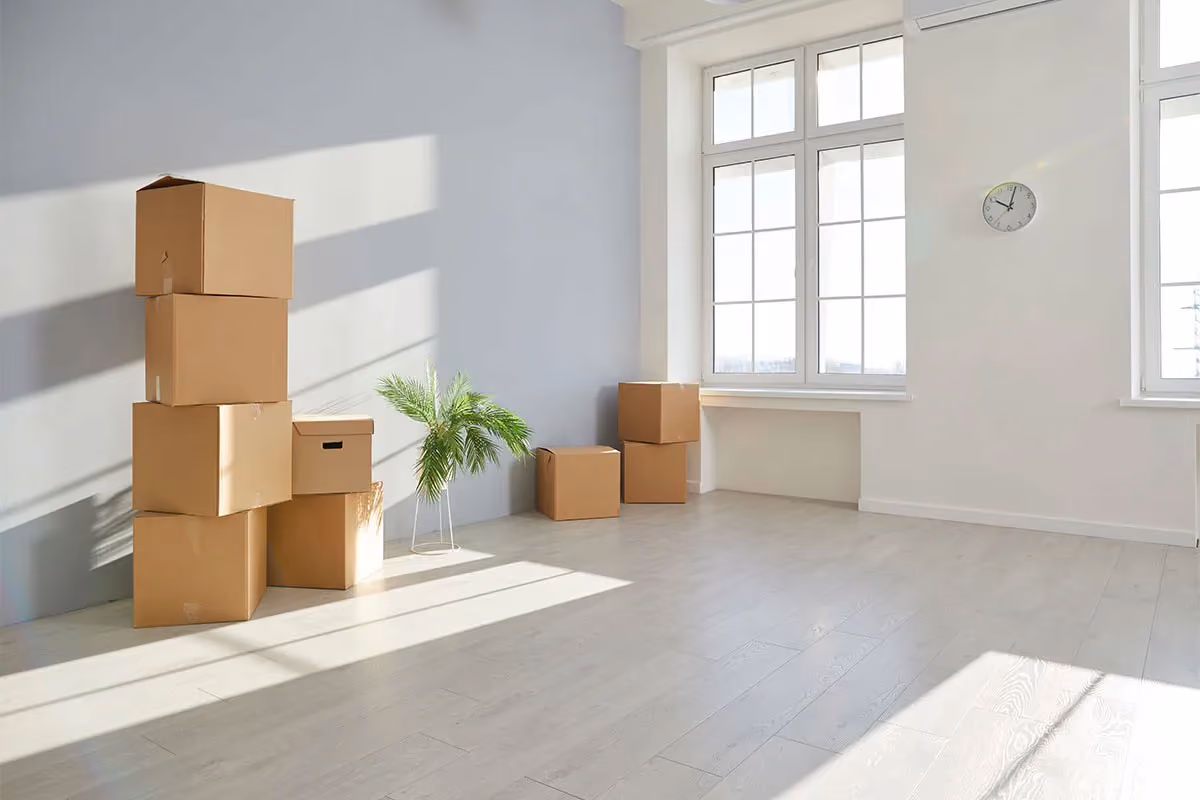 Move-out boxes packed in clean apartment after move-out cleaning.