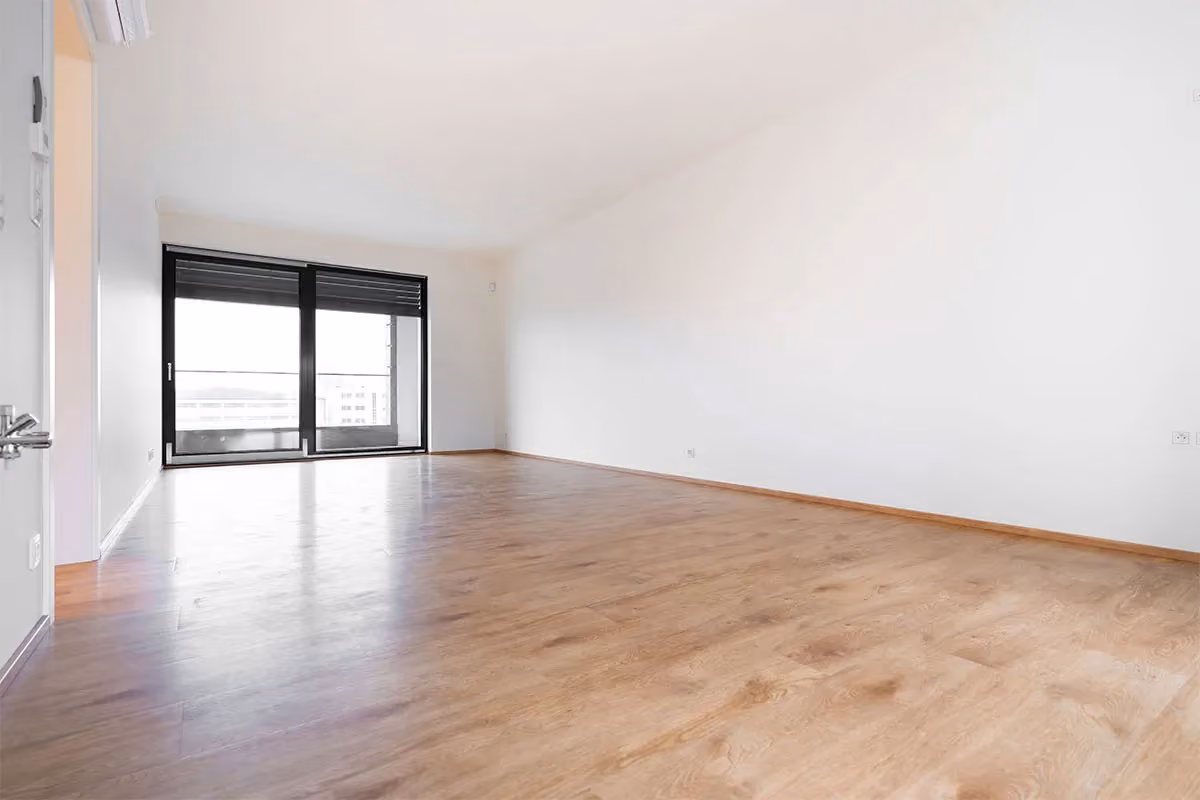 A spacious, empty apartment that has had post-construction cleaning.