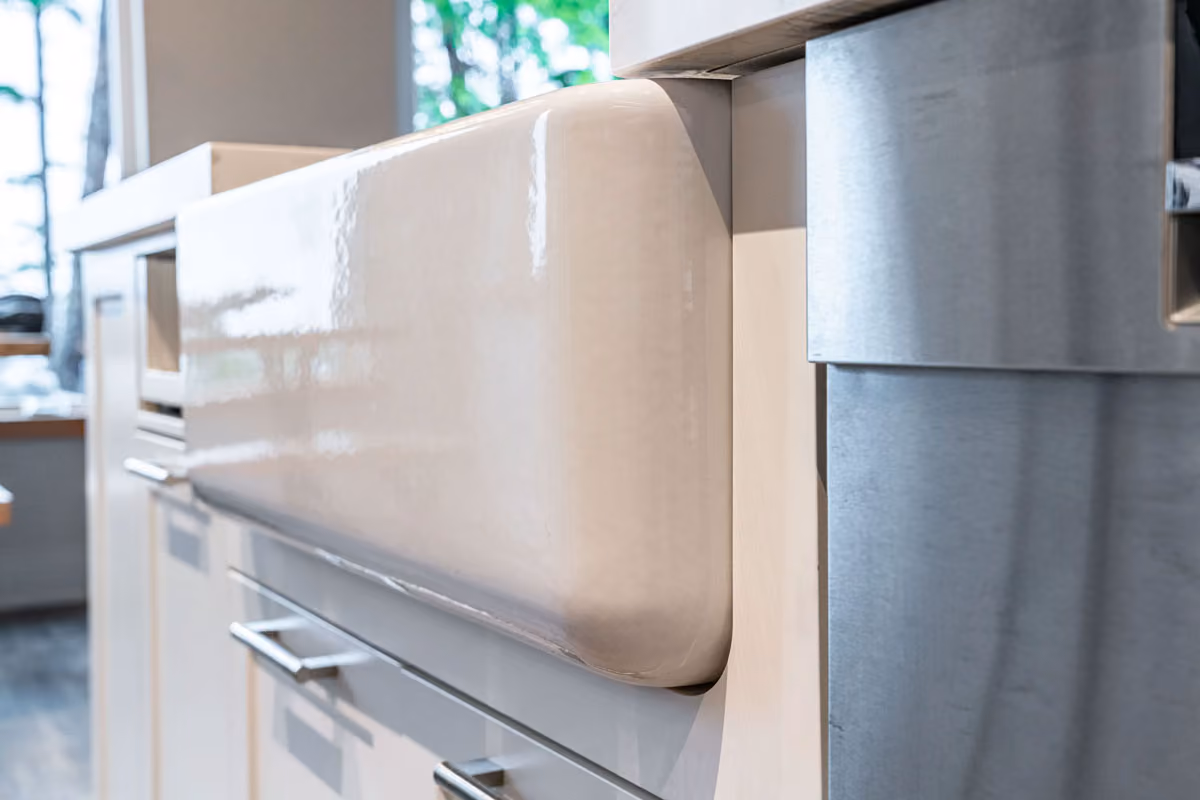 A sparkling clean kitchen sink, highlighting the expertise and care taken.