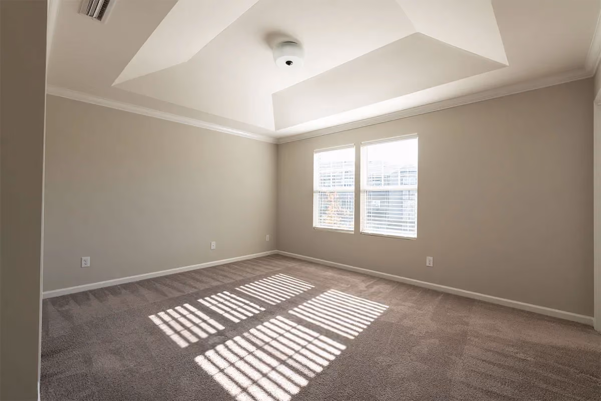 A clean, unfurnished room.