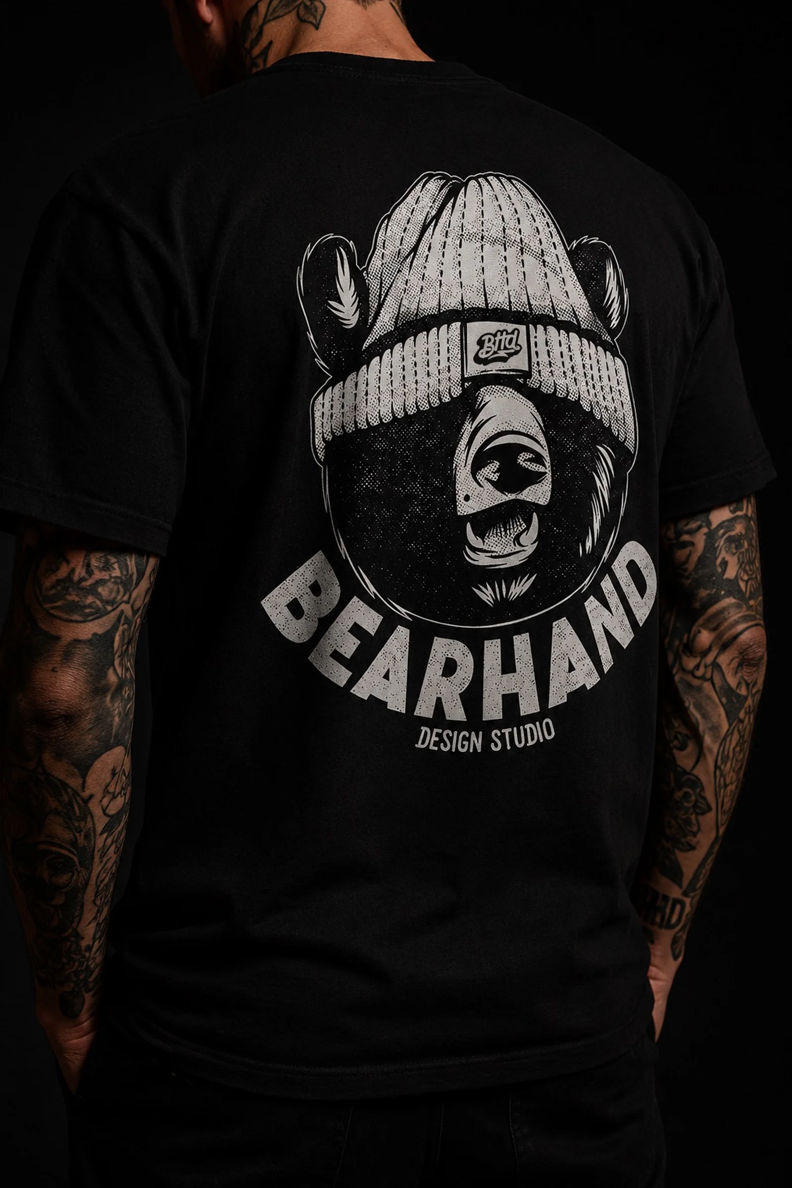     Black T-shirt featuring a large BEARHAND bear illustration printed on the back.
