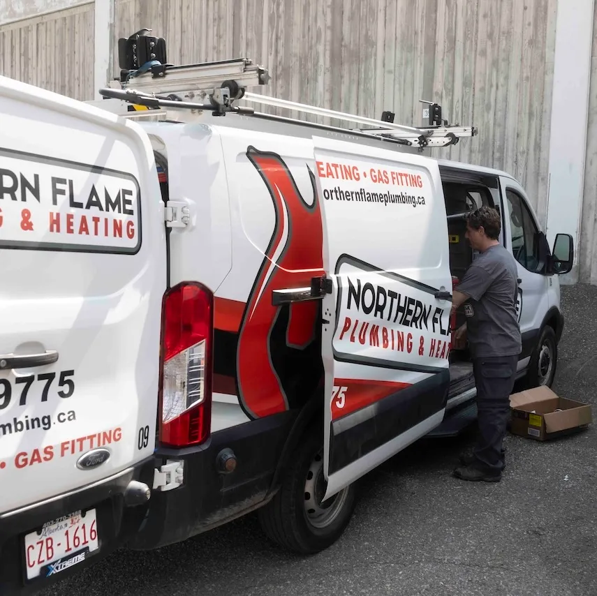 Northern Flame service van outside a Calgary condo building