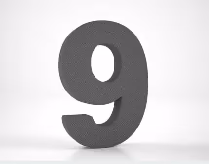A large dark grey three-dimensional numeral 9 on a plain light background