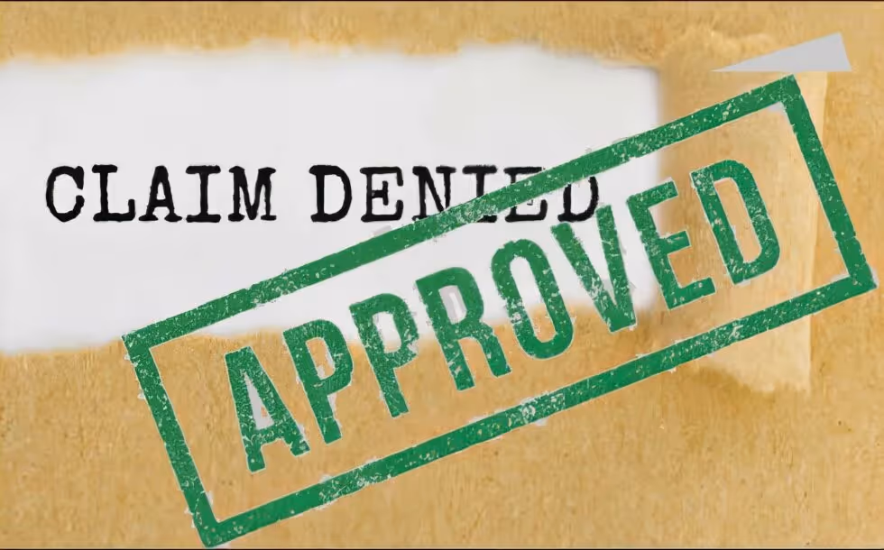 A green APPROVED stamp overlaid on a document reading CLAIM DENIED