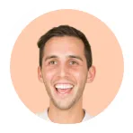Smiling man with short brown hair and light skin against a peach circular background.