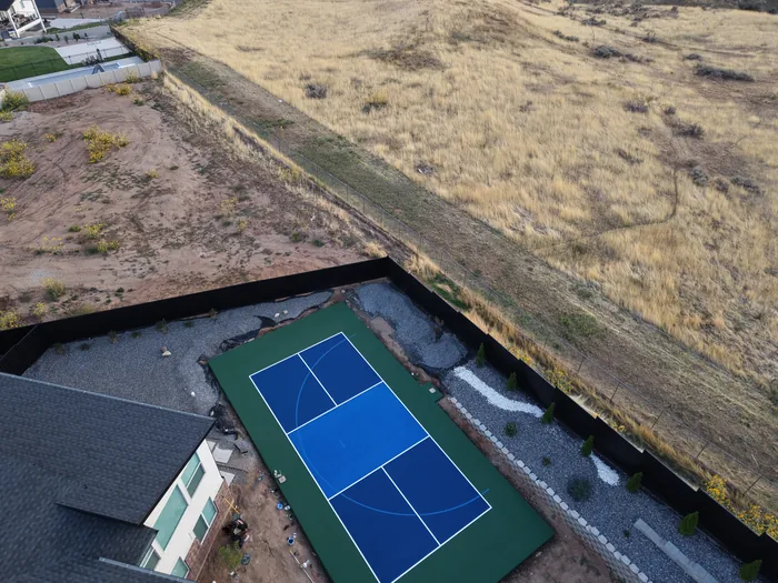 High aerial view of the Pleasant View sport court along the landscaped hillside
