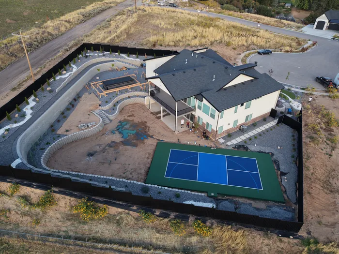 Overhead view of the Pleasant View backyard and blue sport court