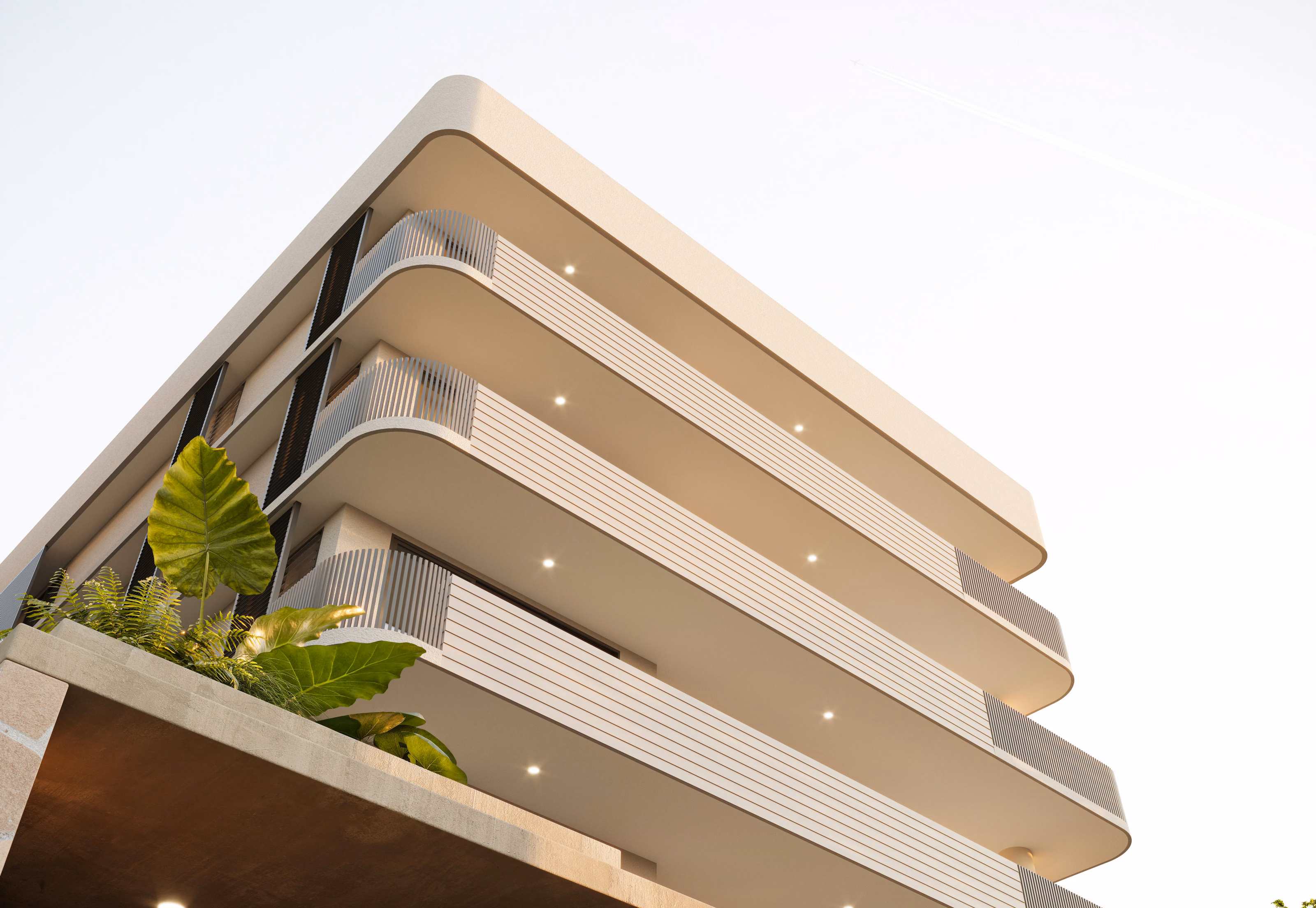 Modern multi-story building with rounded balconies, vertical slats, and greenery on the lower level.
