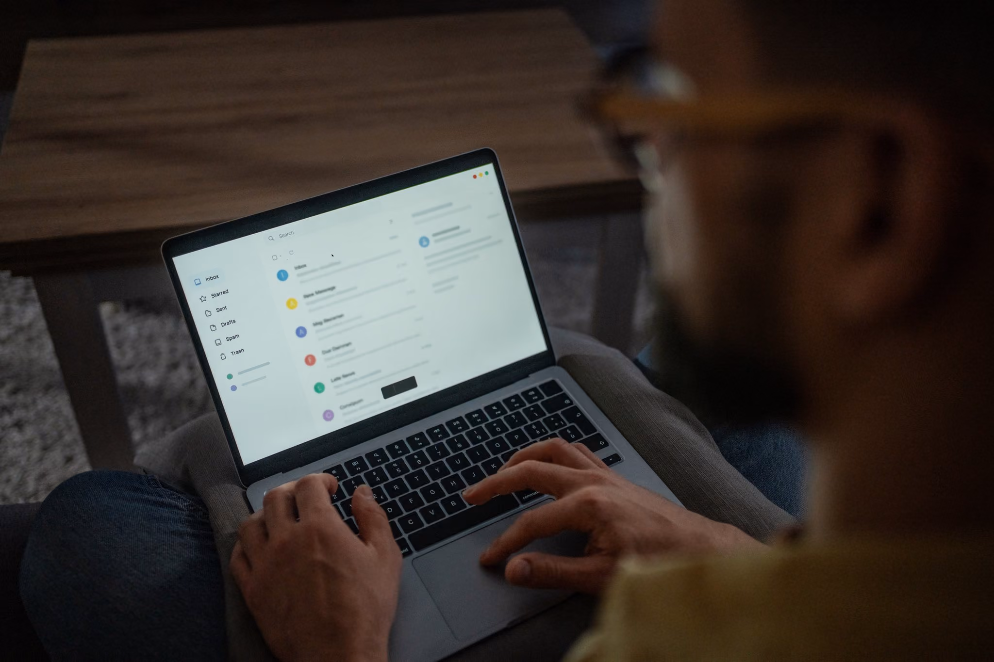 Person checking emails on a laptop at home