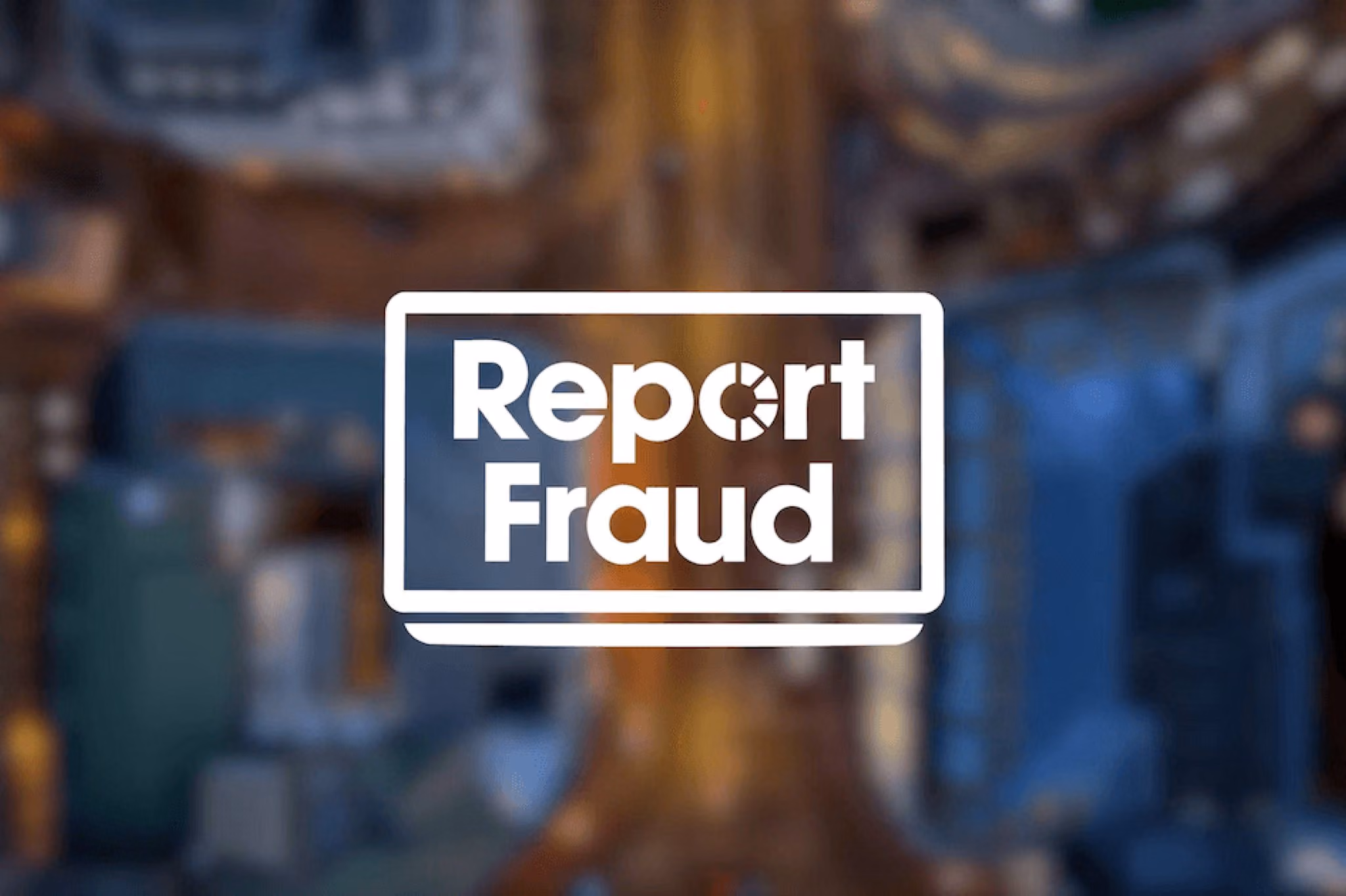 The Report Fraud logo over an aerial view of a city street at night