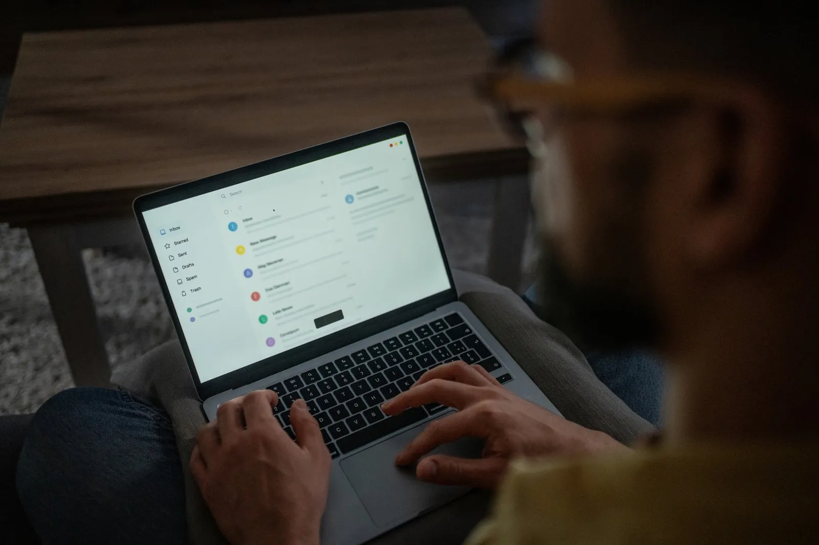 Person checking emails on a laptop at home