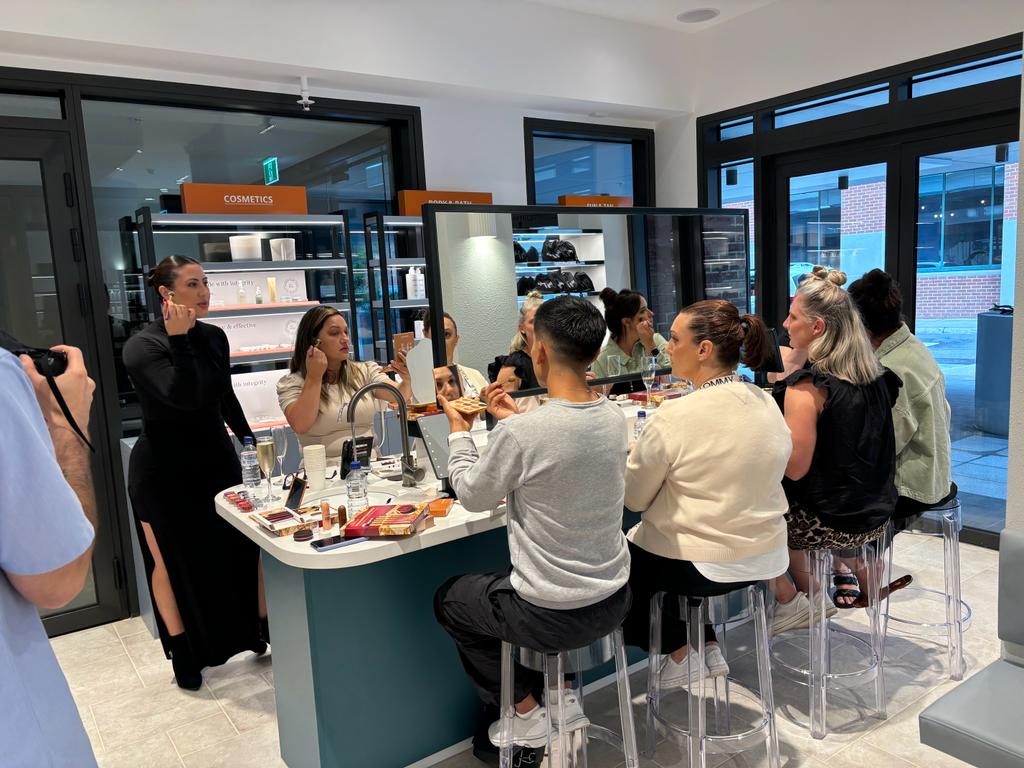 Guests at a makeup class hosted by Tatiana Angulo