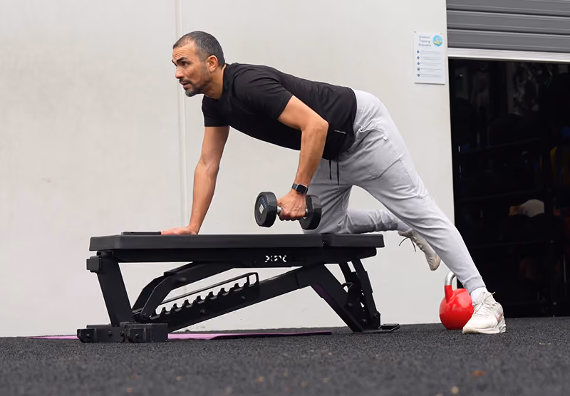man working out in home gym