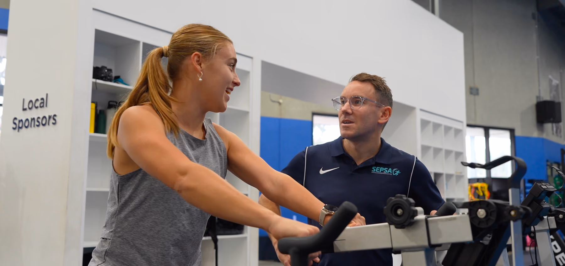 chris helping athlete client on a treadmill