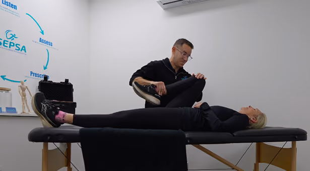 chris-helping-client-with-stretching
