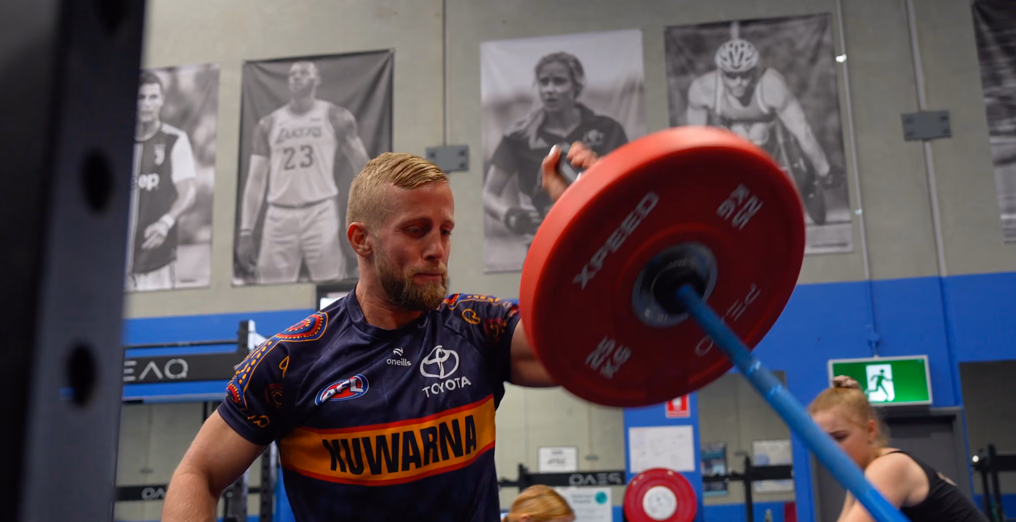 client lifting heavy barbell in sepsa gym