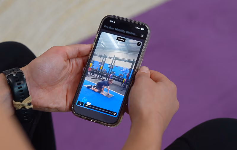 close up of using the new sepsa phone app in gym
