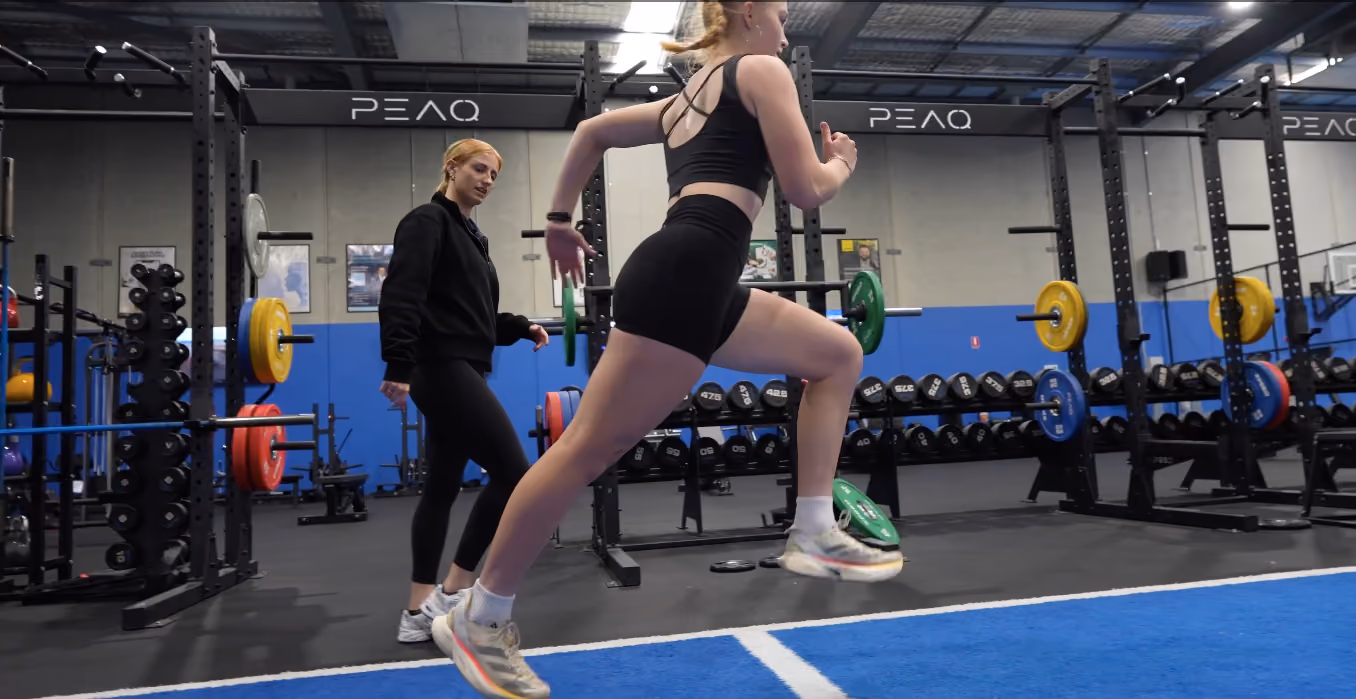 chantel helping runner inside peaq gym