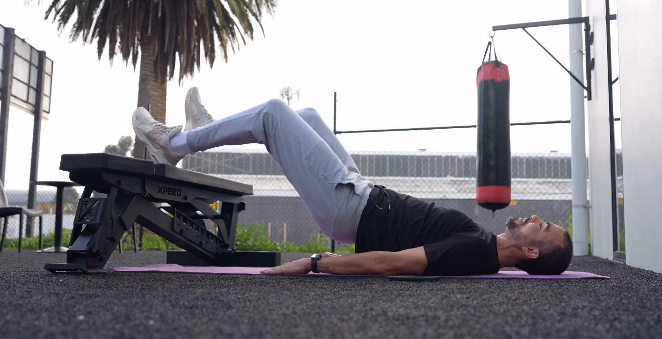 man doing workout at home gym on bench