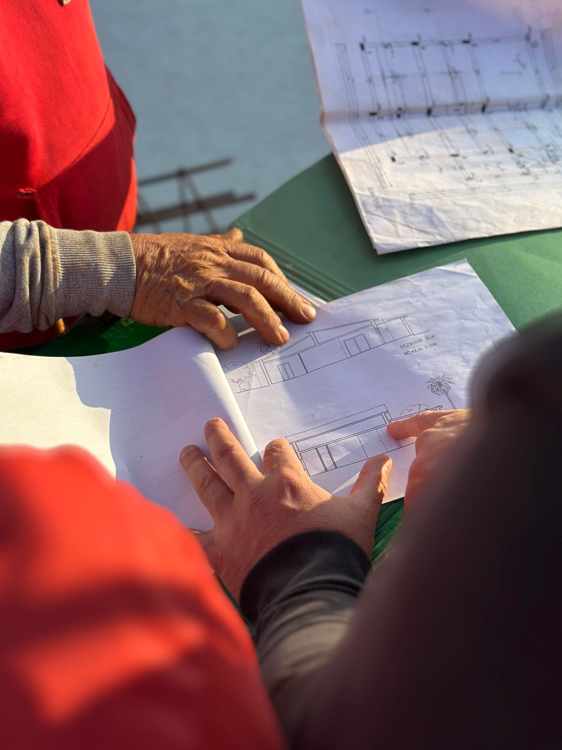 Reviewing plans outdoors on site
