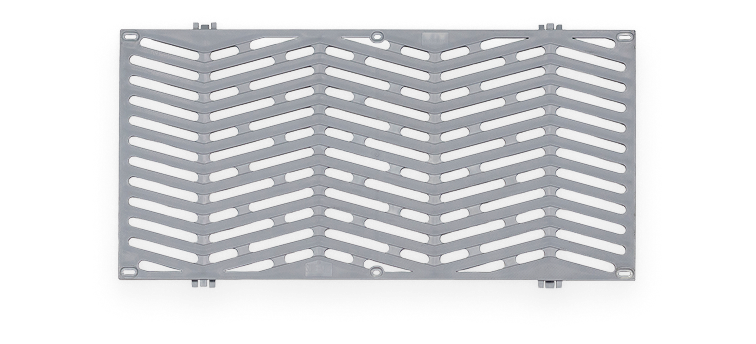 Rectangular metal grate with diagonal slits arranged in a chevron pattern.