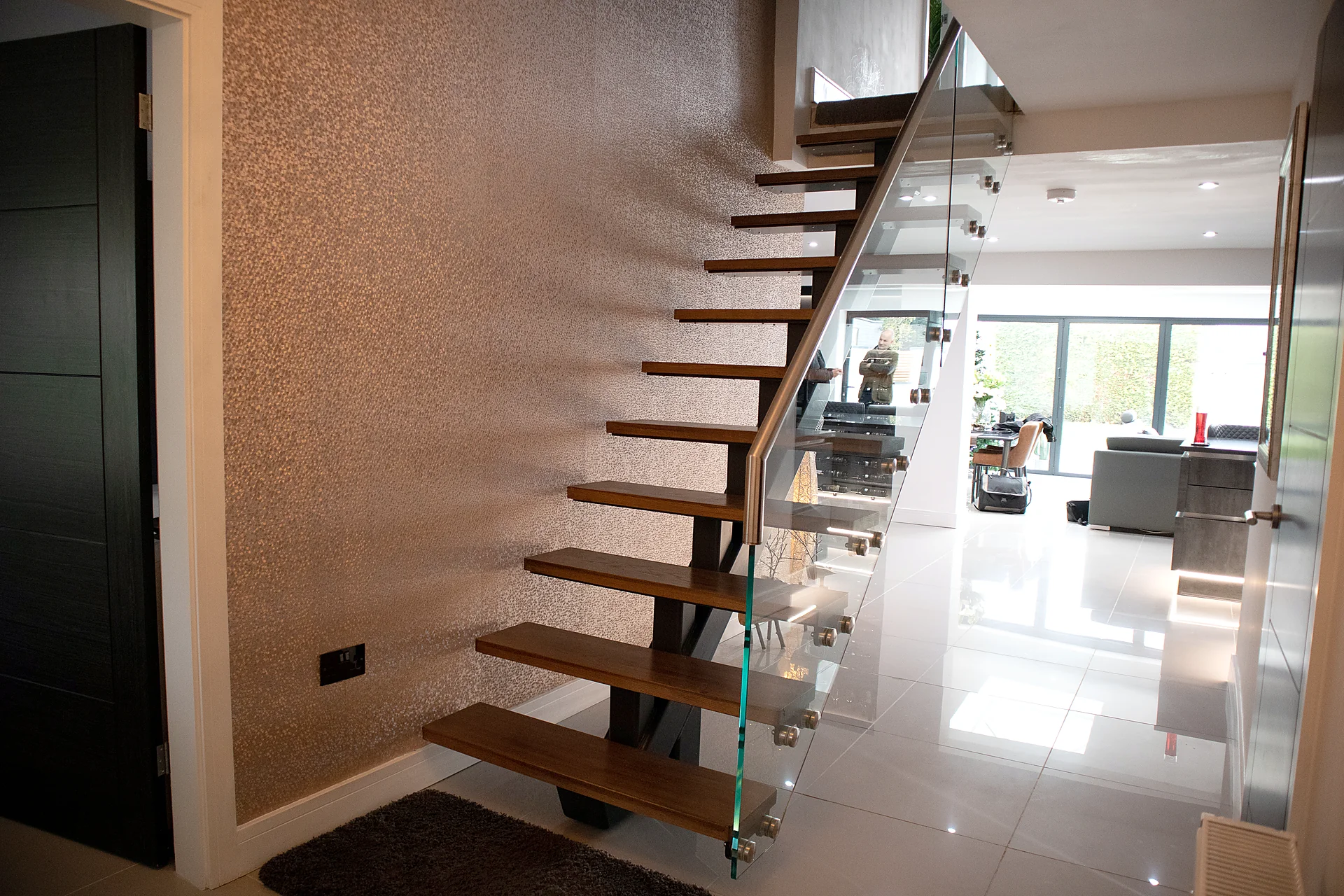 Floating timber staircase with a glass balustrade
