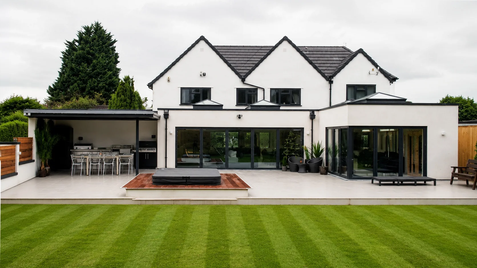 Rear of a renovated and extended home in Astwood Bank, with an outdoor kitchen and swim spa
