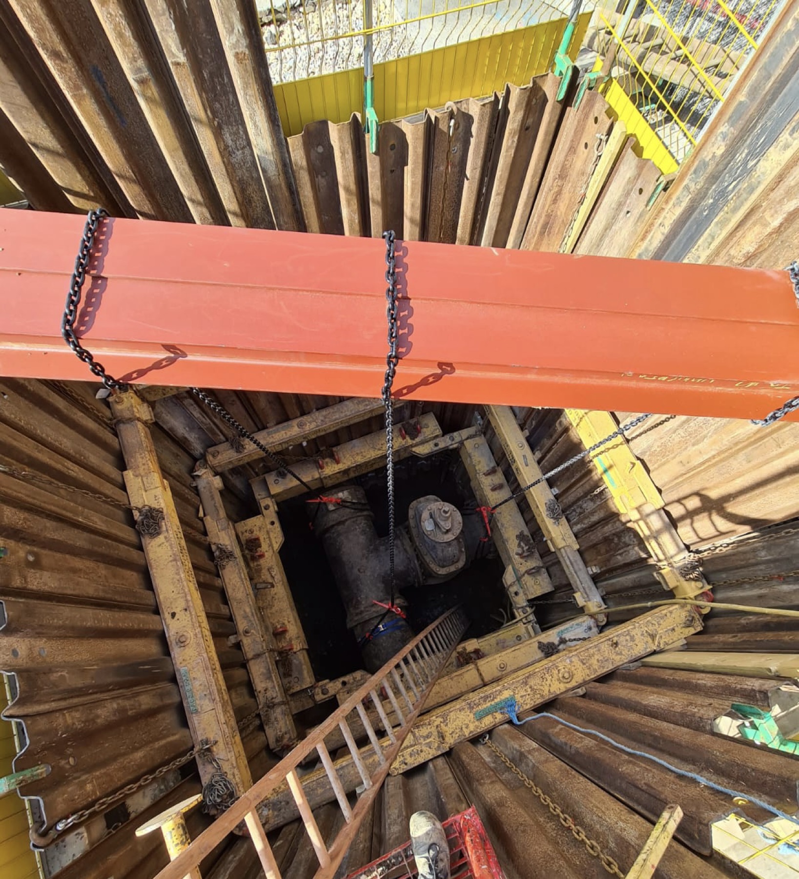 Deep shored excavation shaft with valve and access ladder