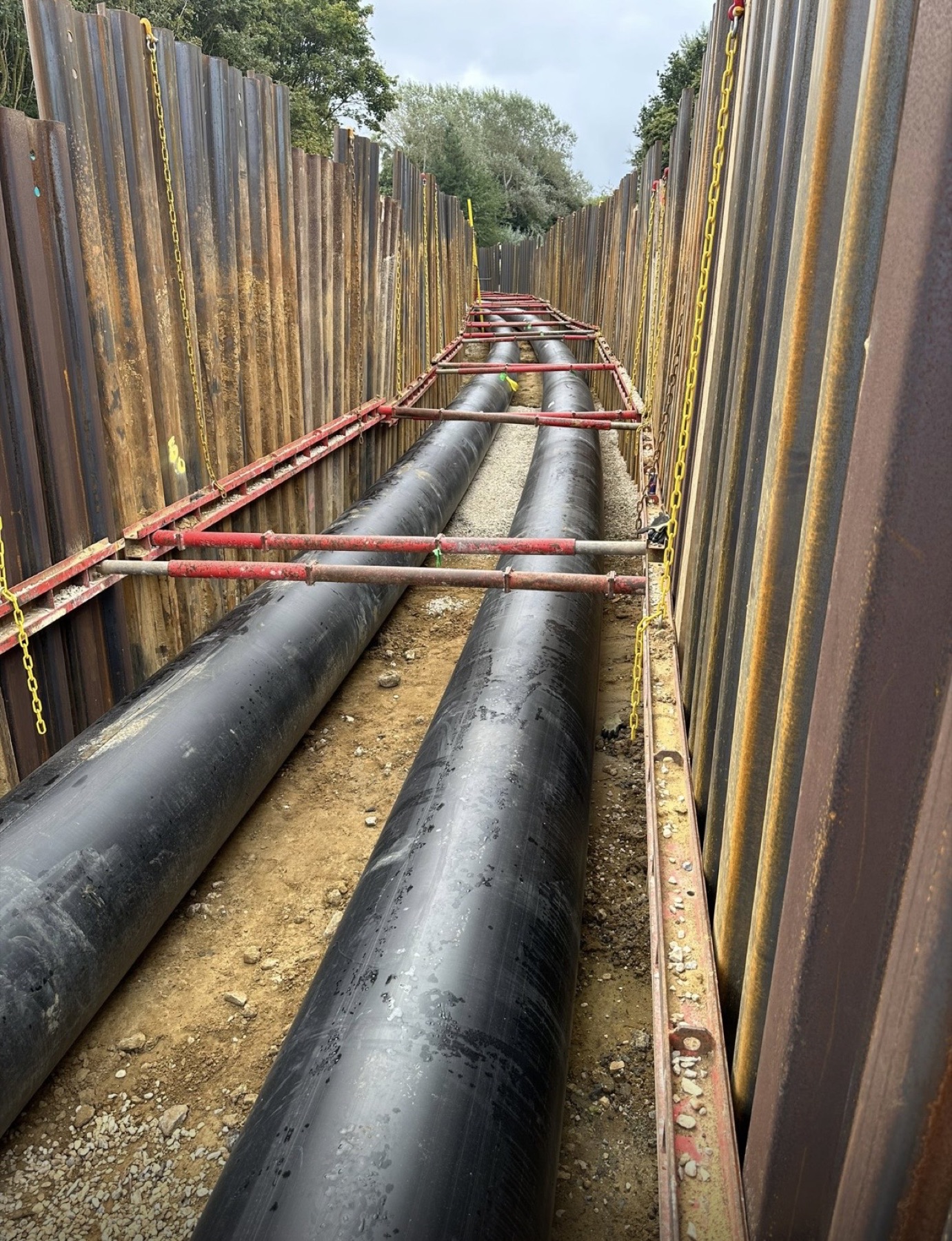 Two trunk mains laid in a sheet-piled trench