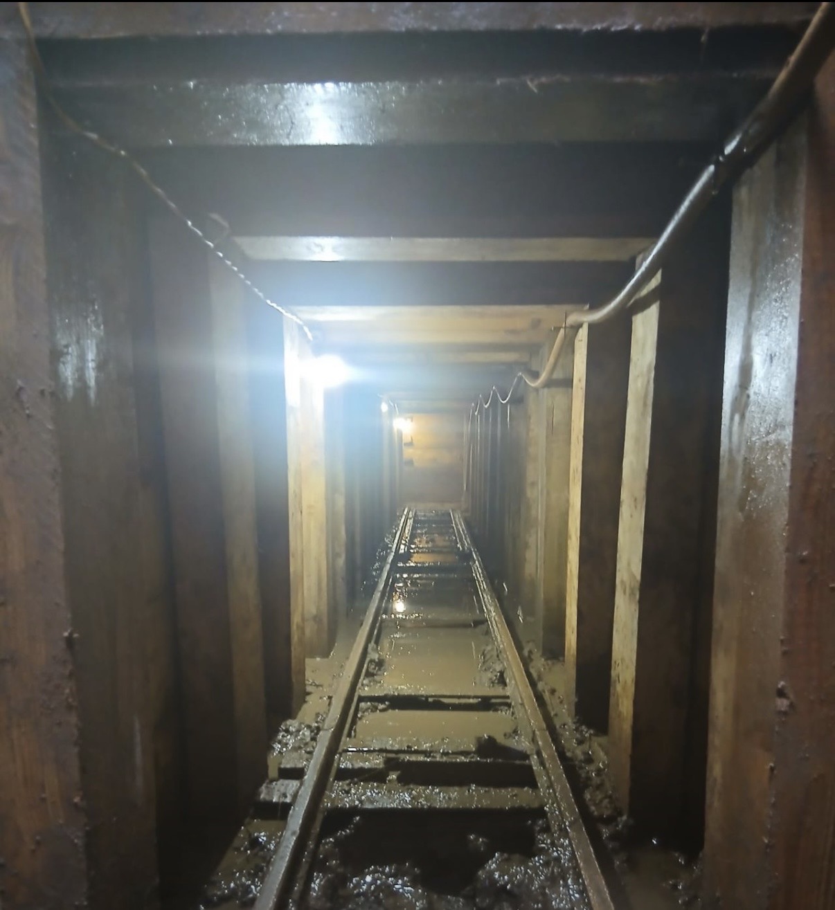 Blue mains in a deep segment-lined shaft