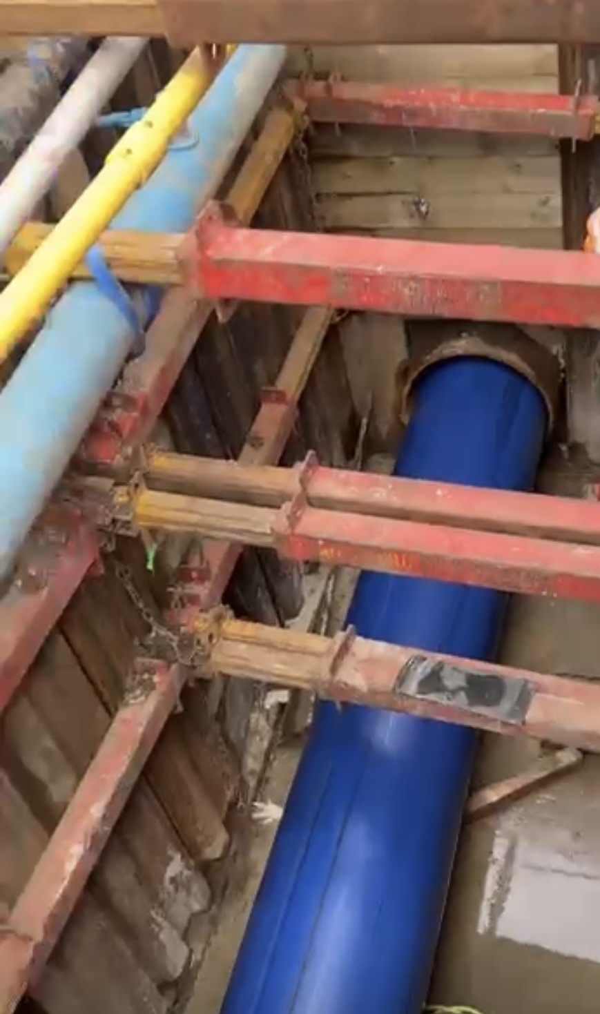 Structural pipework and valves installed in a shored excavation