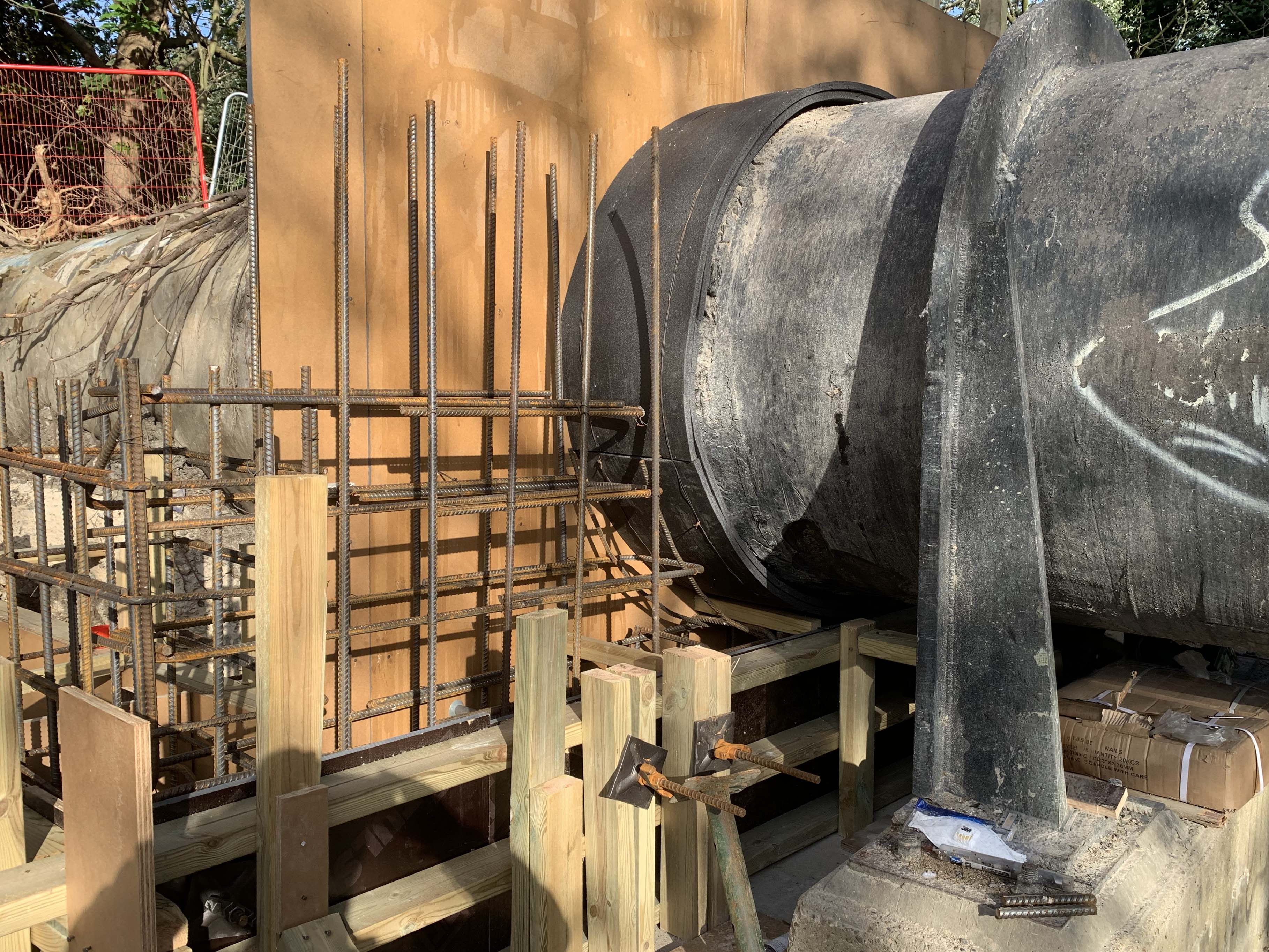 Structural pipework and valves installed in a shored excavation