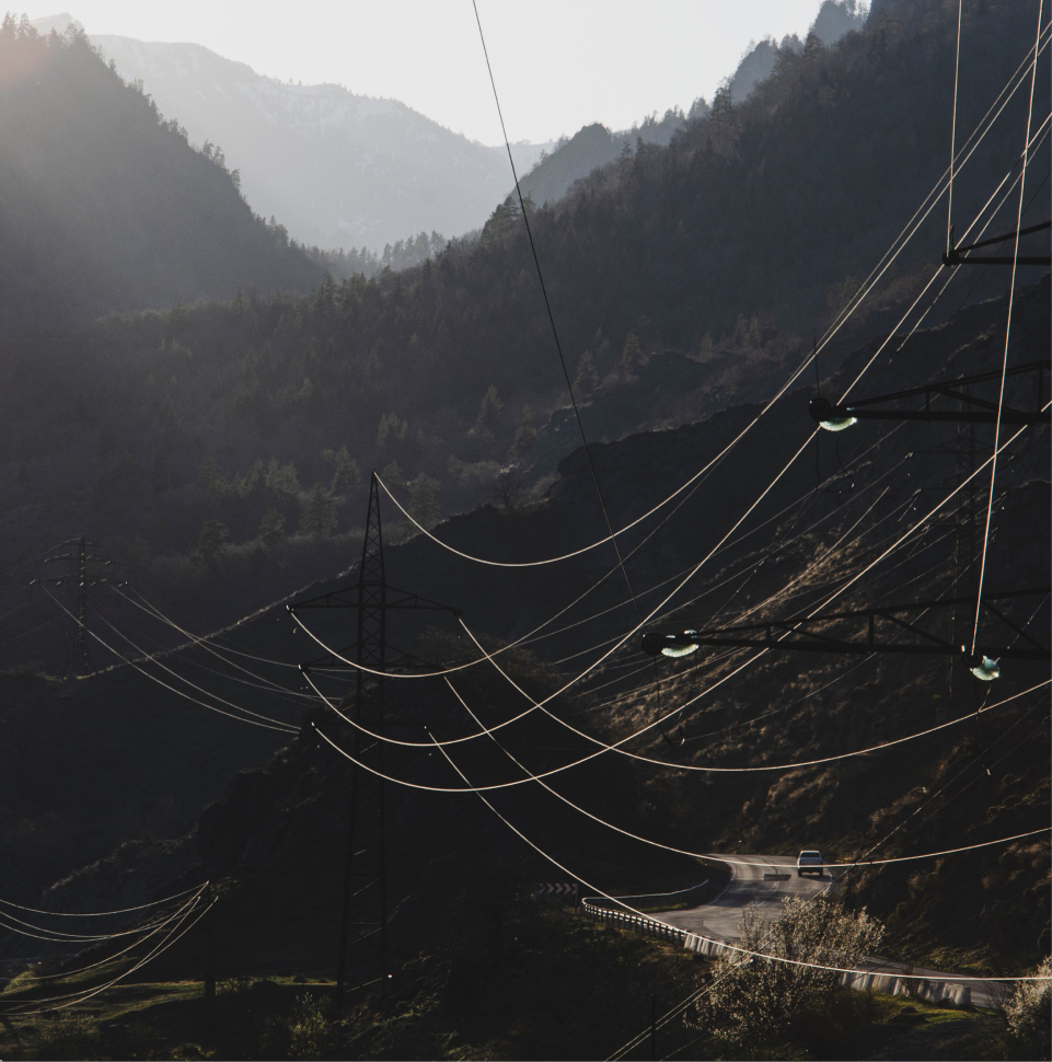 hanging power grid on the side of a mountainous road