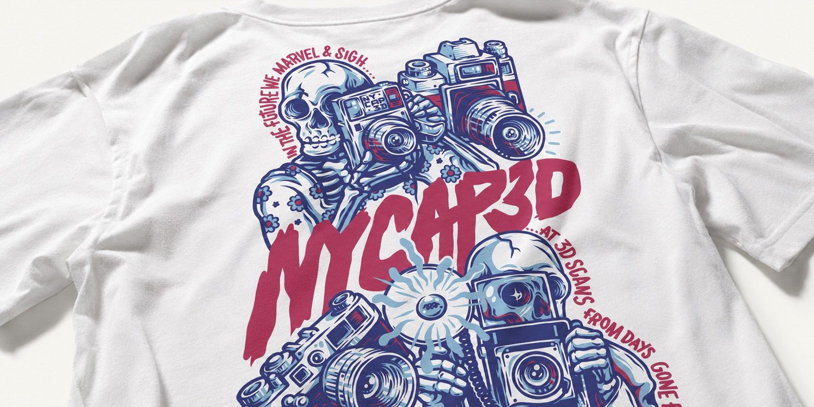 Close-up of illustrated skeleton photographers and vintage camera artwork printed on the back of the NYCAP3D T-shirt.