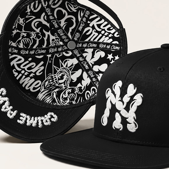 Two black Rich Off Crime caps showing embroidered front logos, side details and a custom printed interior lining.