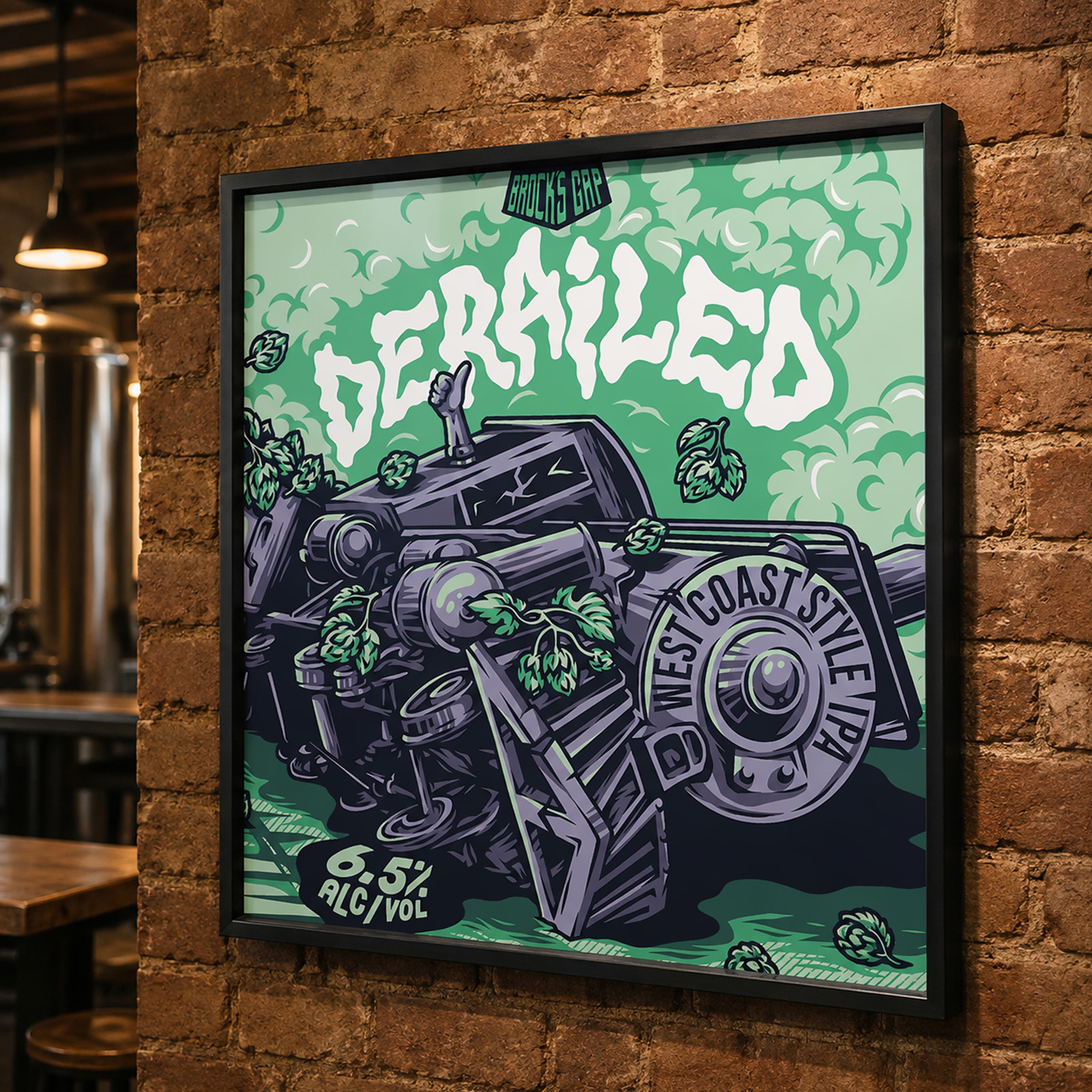 Framed Derailed West Coast IPA artwork displayed on a brick wall inside the Brock’s Gap taproom.