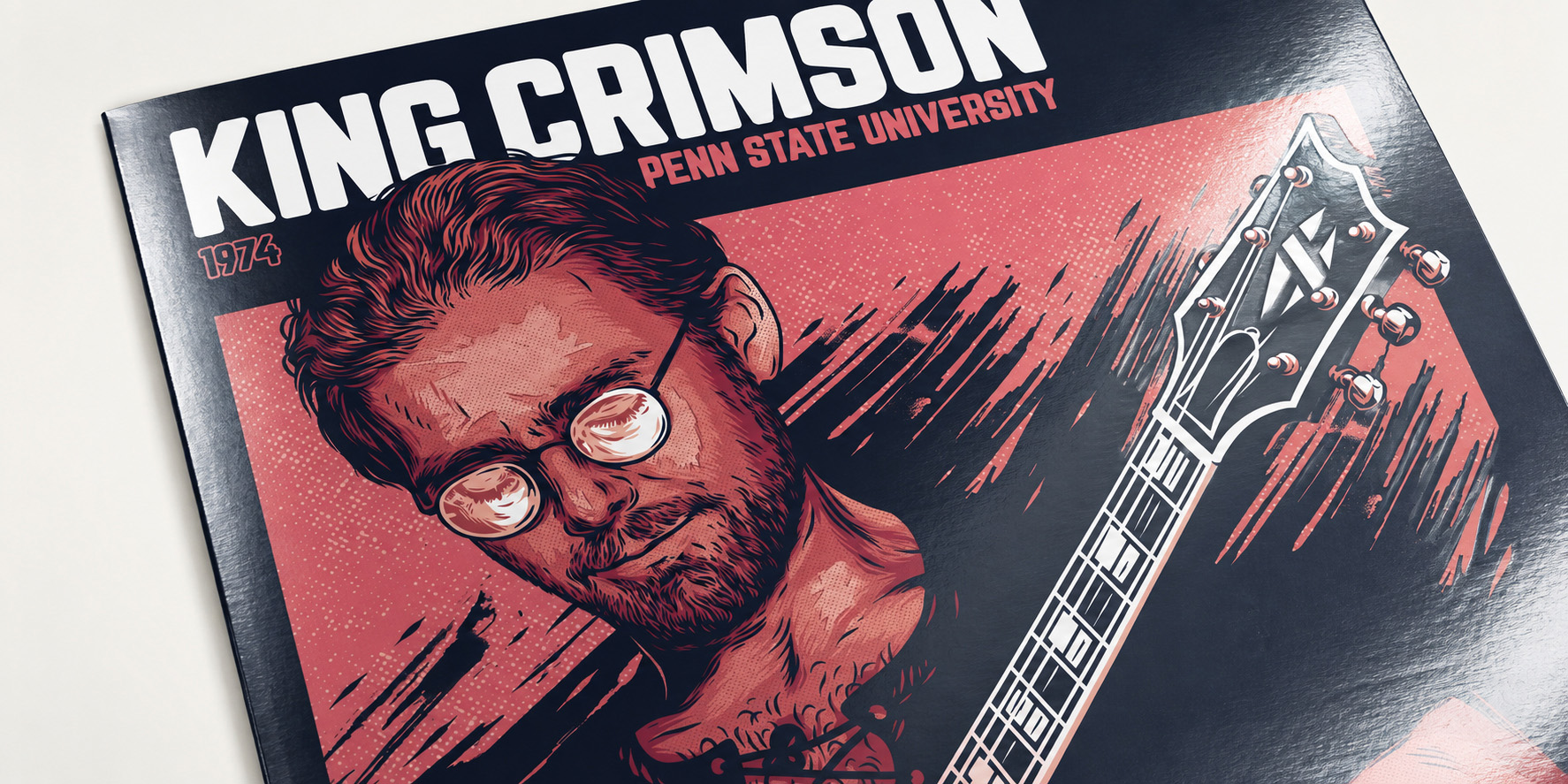Close-up of the glossy King Crimson vinyl sleeve showing the Robert Fripp illustration and guitar.