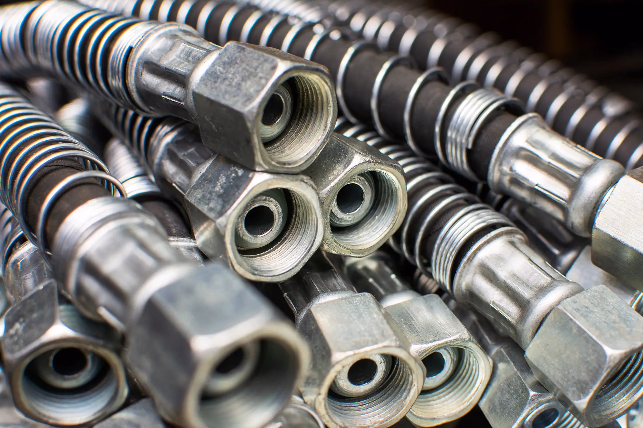 Diesel mechanic performing hydraulic hose repair in Richmond, IN