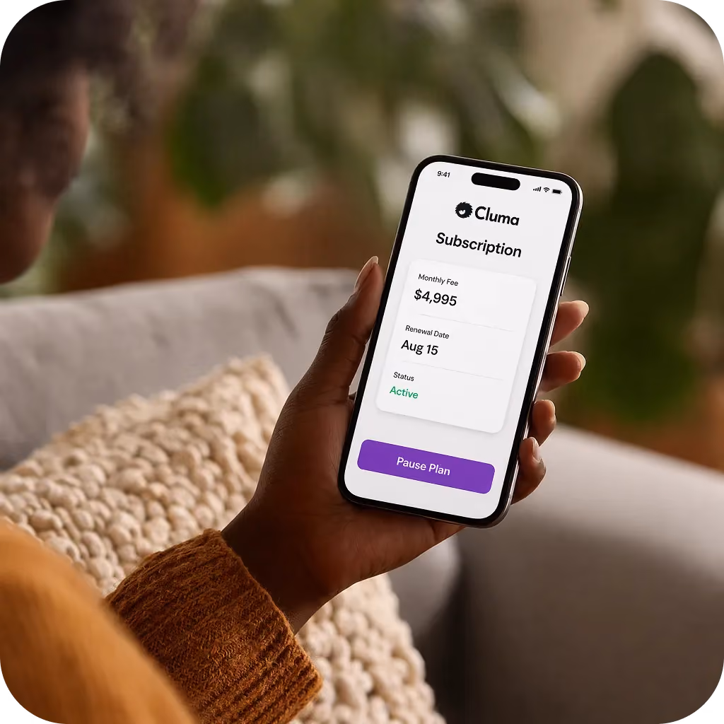 Person holding smartphone displaying Cluma subscription with $4,995 fee, Aug 15 renewal, and active status.