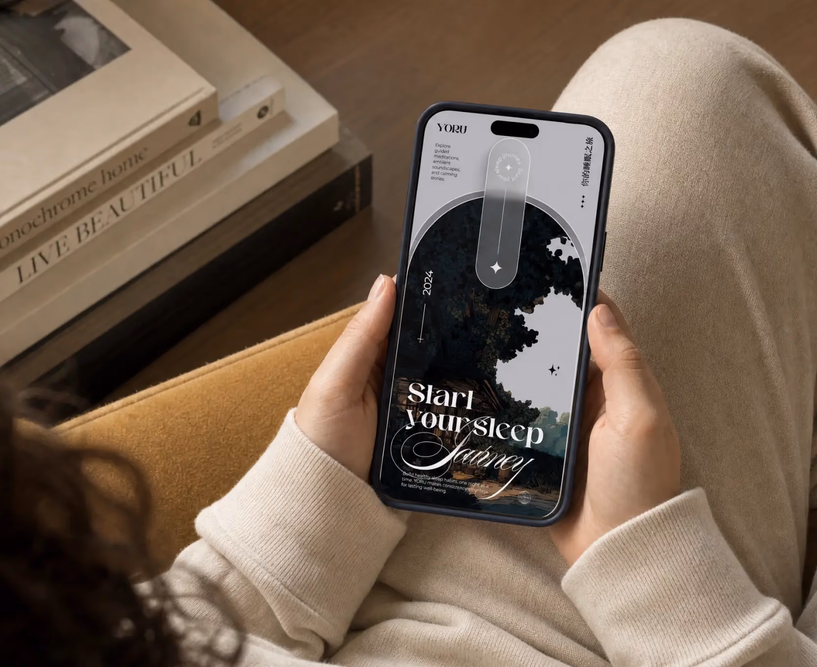 Person holding phone showing app screen with text 'Start your sleep journey' and nature illustration.