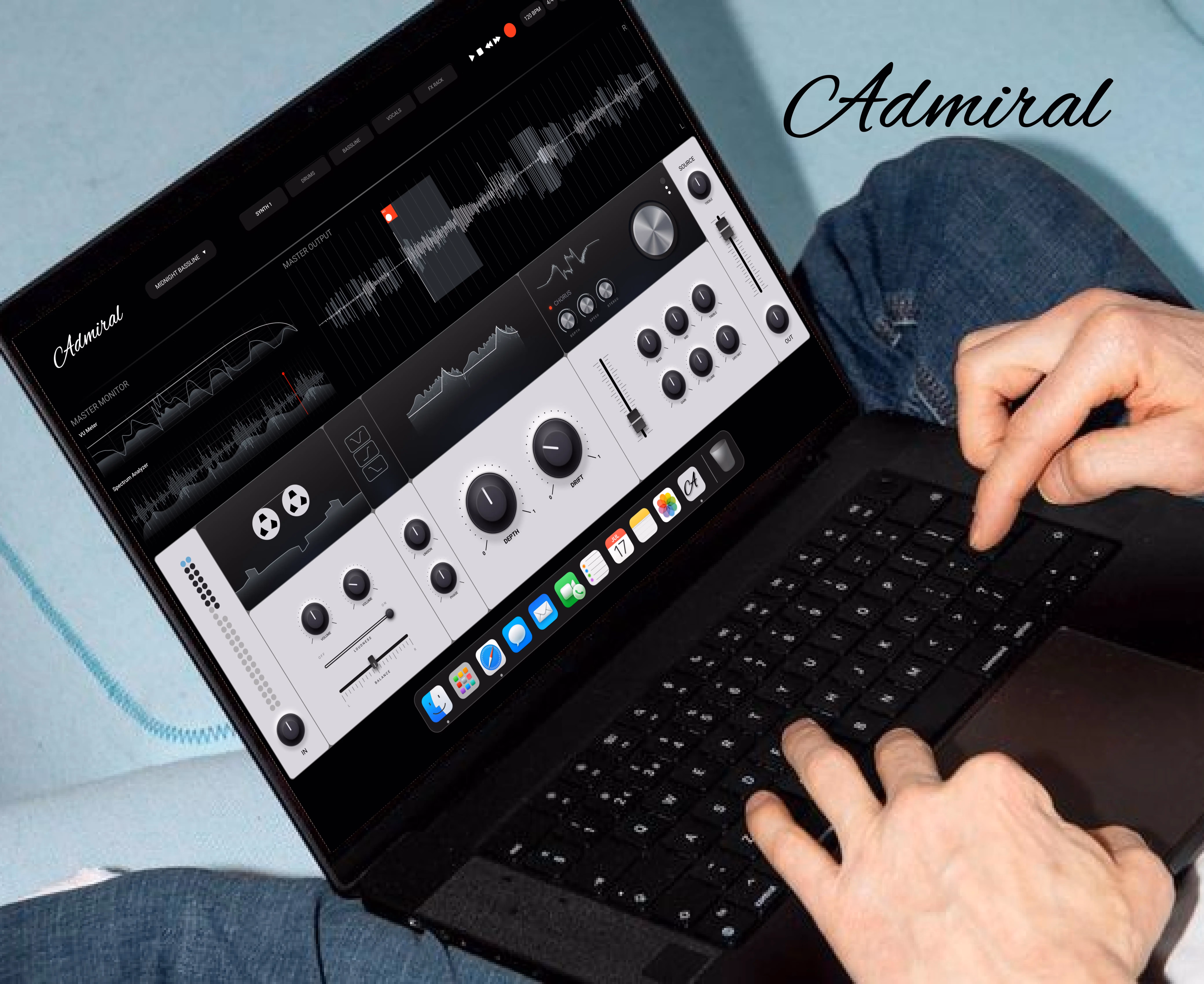 Hands typing on a laptop showing audio editing software named Admiral with waveform and control knobs.