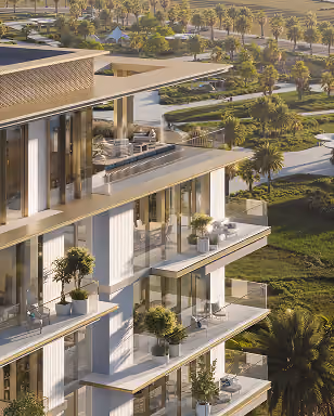 Modern multi-story building with glass balconies and potted plants overlooking a lush green garden.
