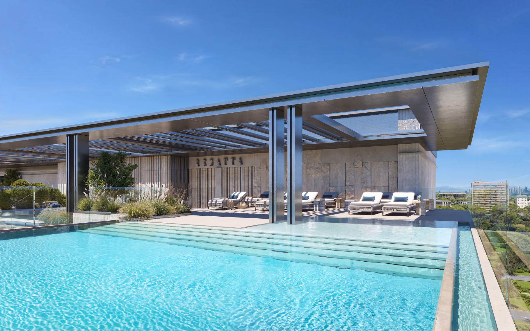 Rooftop infinity pool with lounge chairs and a modern shaded pergola under clear blue sky.