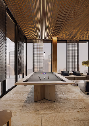 Modern lounge with wooden ceiling, large windows, and a gray pool table in the center.