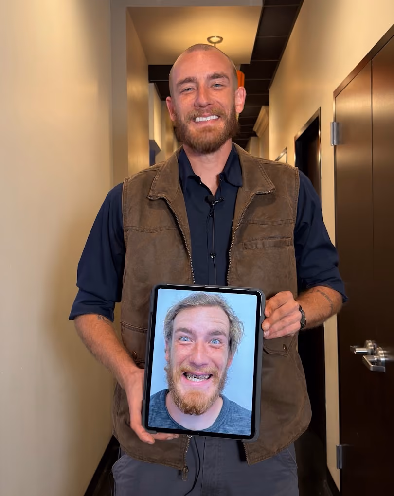 Patient smiling after treatment at Dentiq Dentistry in Houston, TX